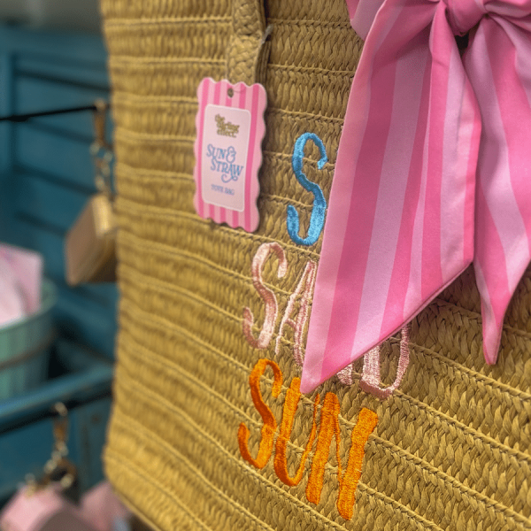 Merle Norman and More raffia summer bag with pink bow